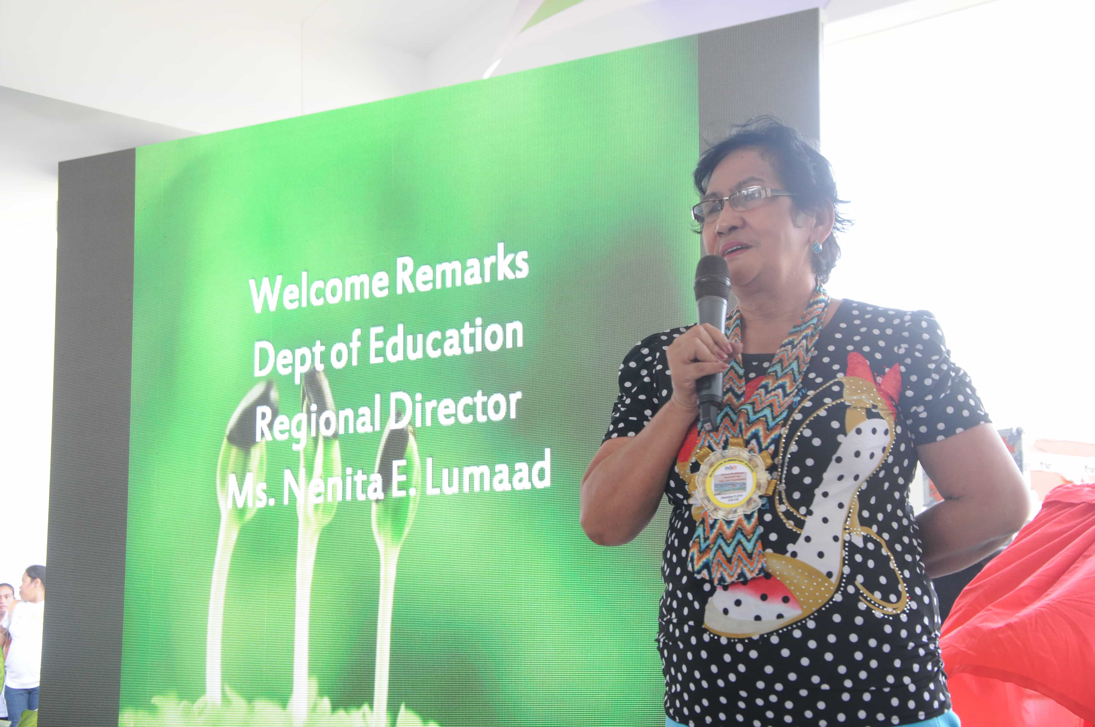 Department of Education Regional Director Nenita Lumaad addresses guests during the turnover ceremony of Mangayon Elementary School on December 1, 2014.
