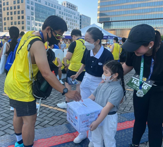 Four-year-old Tzu Chi volunteer Sephora Hung helps receive donations to raise funds for the victims of the recent magnitude 7.4 quake in Hualien, Taiwan.