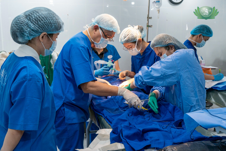 Dr. Josefino “Jo” Qua (second from left) leads fellow volunteer doctors and nurses as they operate on a patient.