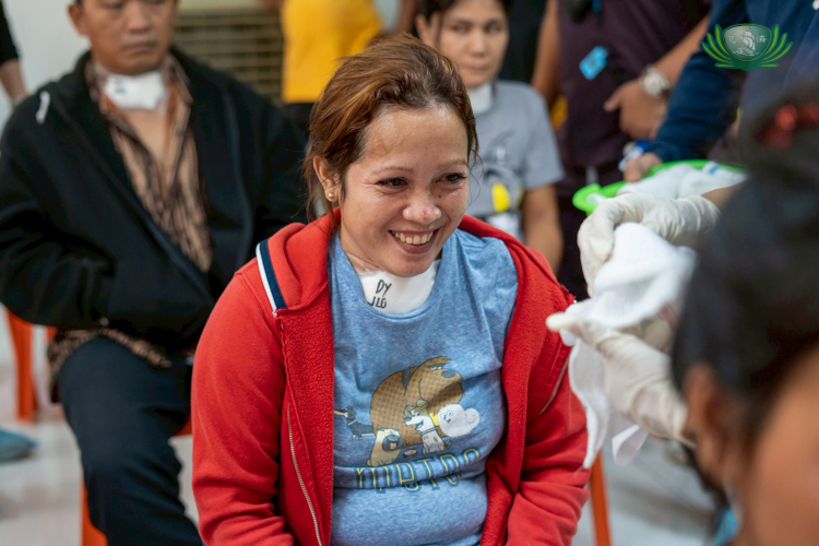 Patient Beverly Juablar shares a big smile after her successful goiter operation.