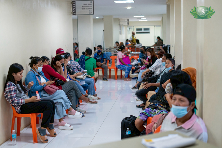 Inside the Dr. George T. Hofer Medical Center, hundreds of patients wait in line for their surgical consultations.