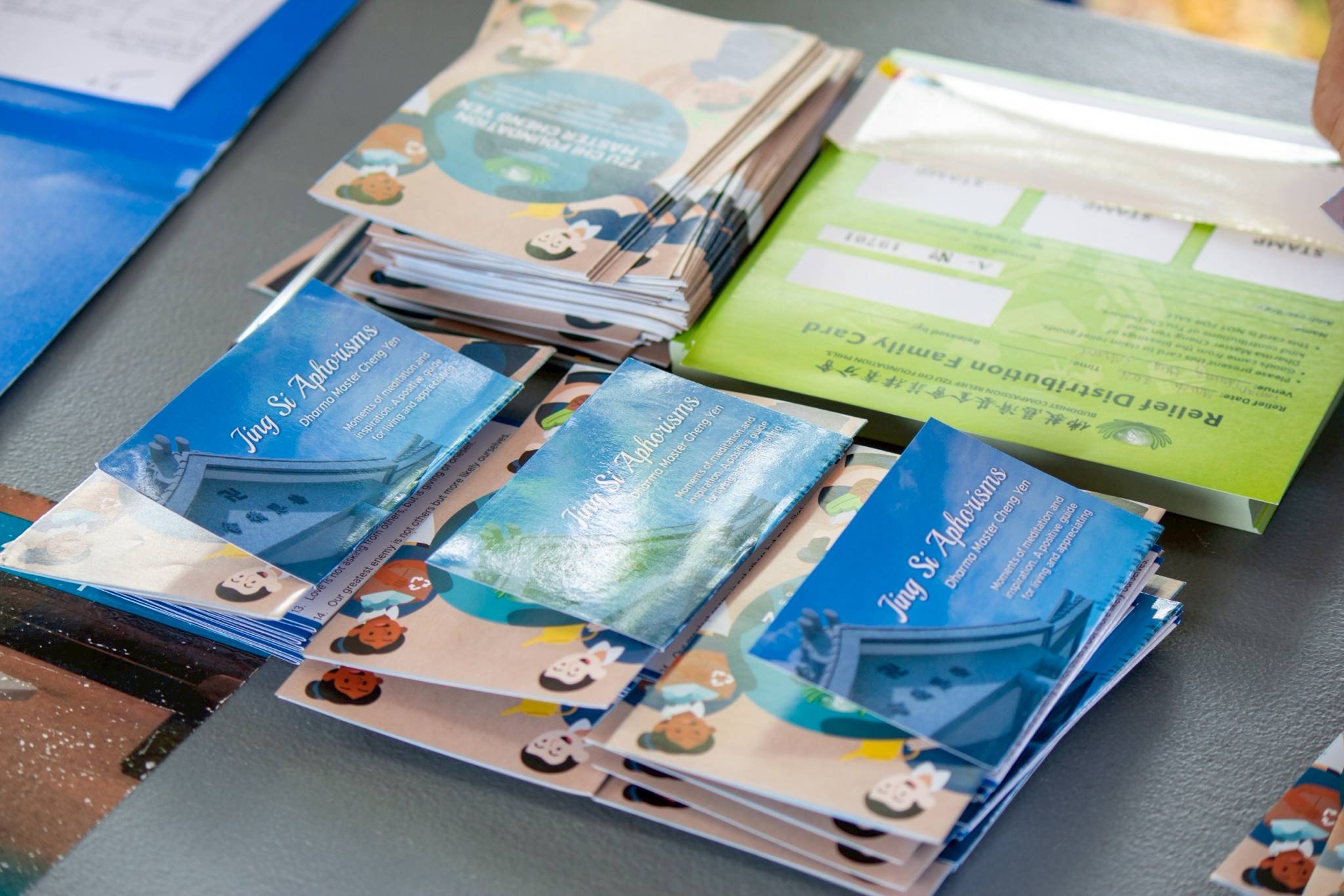 Jing Si Aphorism pamphlets by Master Cheng Yen are  distributed to beneficiaries during the registration process.