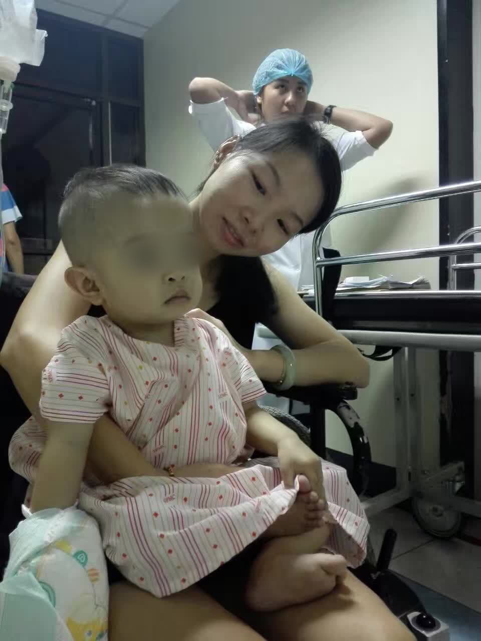 One-year-old Sam Anthony Tan with his mother Liu Fang after his open-heart surgery in April 2017.