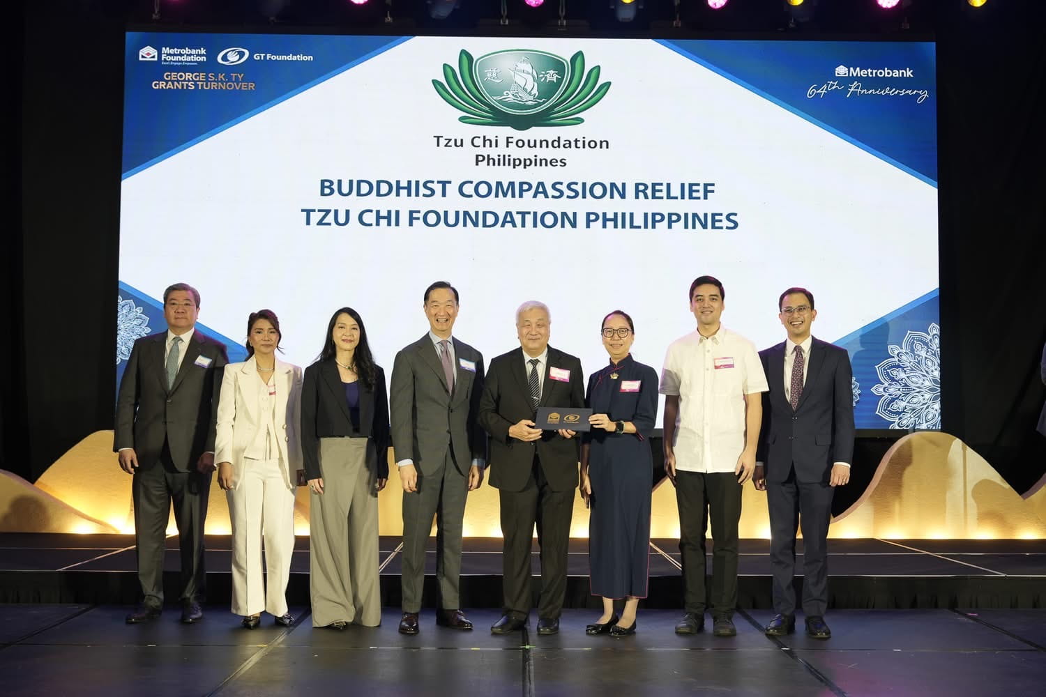 Tzu Chi Philippines CEO Henry Yuñez and Deputy CEO Peggy Sy Jiang (fifth and sixth from left) accept a grant during the annual George S.K. Ty Grants Turnover Ceremony of Metrobank Foundation and GT Foundation Inc.
