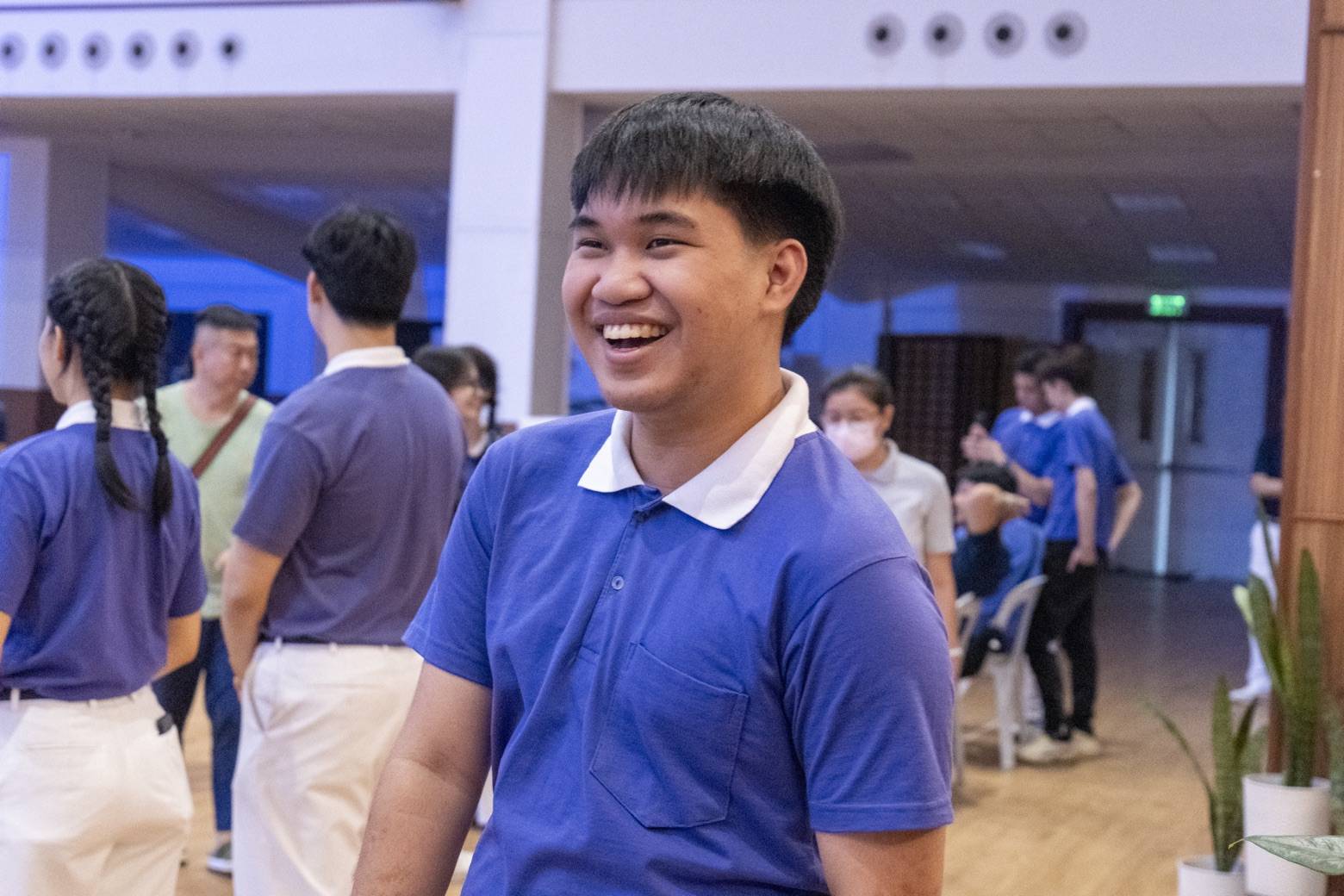 John Davidson Luy is all smiles at the closing of the 2026 Tzu Chi Youth Camp in the Jing Si Hall of Buddhist Tzu Chi Campus.  