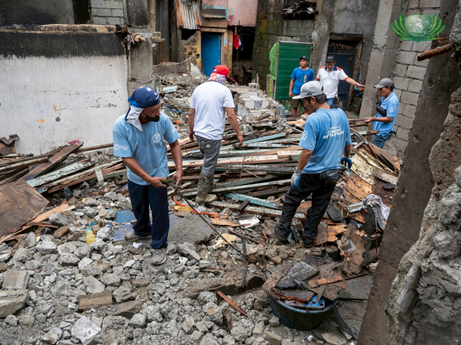 A week after the fire in Bronze Street, Malanday, Marikina, families continue to stay at a nearby evacuation area as their homes were reduced to ashes.