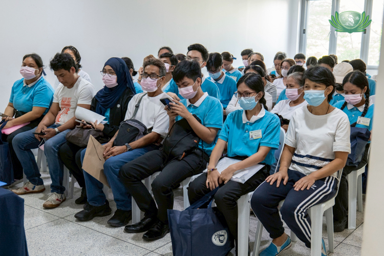 Tzu Chi scholars and their parents wait for their turn to be interviewed in the April 6 reapplication of college scholars at the Harmony Hall of Buddhist Tzu Chi Campus, Sta. Mesa, Manila. 