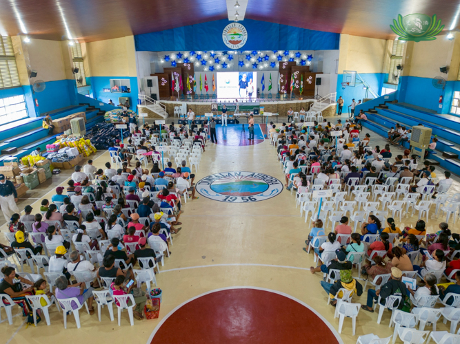 Aerial view of the Dingalan Municipal Gym as residents begin to gather for the relief distribution.