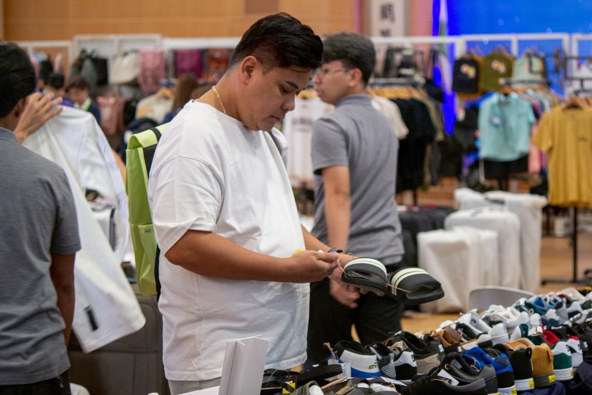 A shopper checks out a footwear at the DC stall.