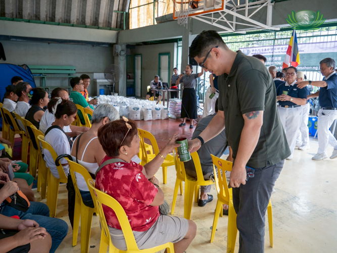 Beneficiaries continue to help others by sharing their blessings through the Tzu Chi coin can.