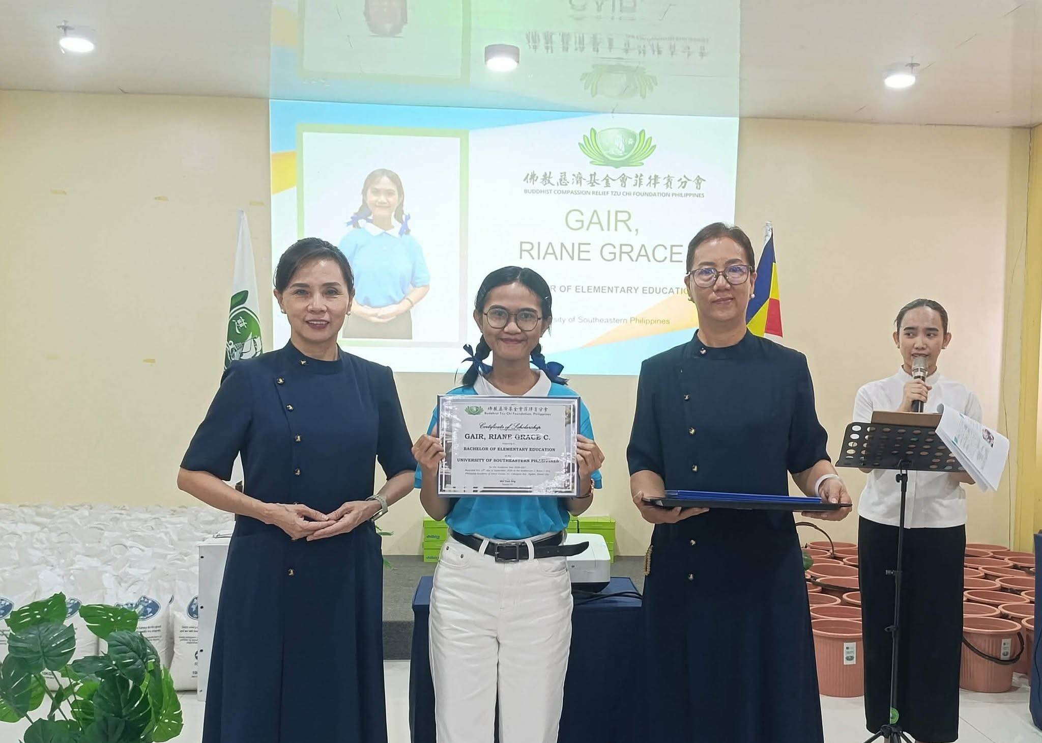 In Tzu Chi Davao, 15 new scholars proudly receive  their certificates of scholarship as Tzu Chi expands its educational support in the region.