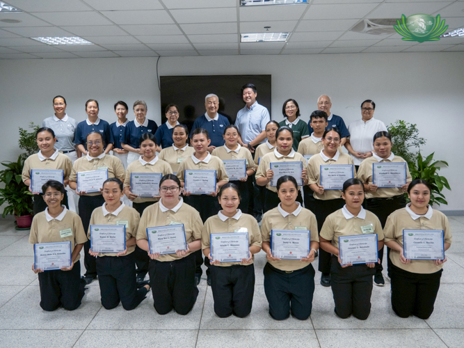 Scholars from Tech-Voc’s Batch 11 caregiving course pose with Tzu Chi volunteers and representatives from Lao Foundation, Inc.