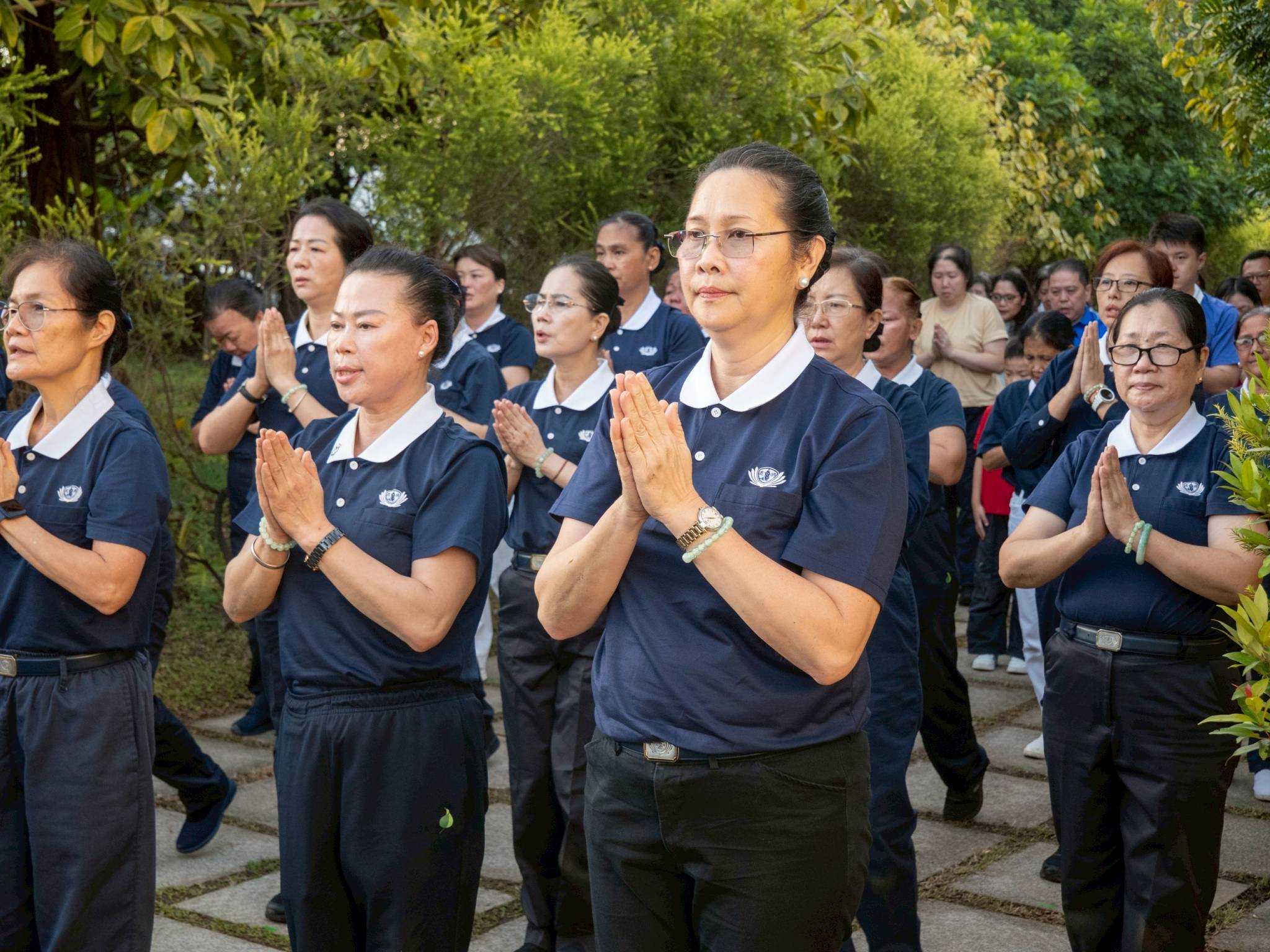 Joy Gatdula (foreground) stands with her fellow Tzu Chi volunteers as they all share a moment of service, spreading humility and gratitude.