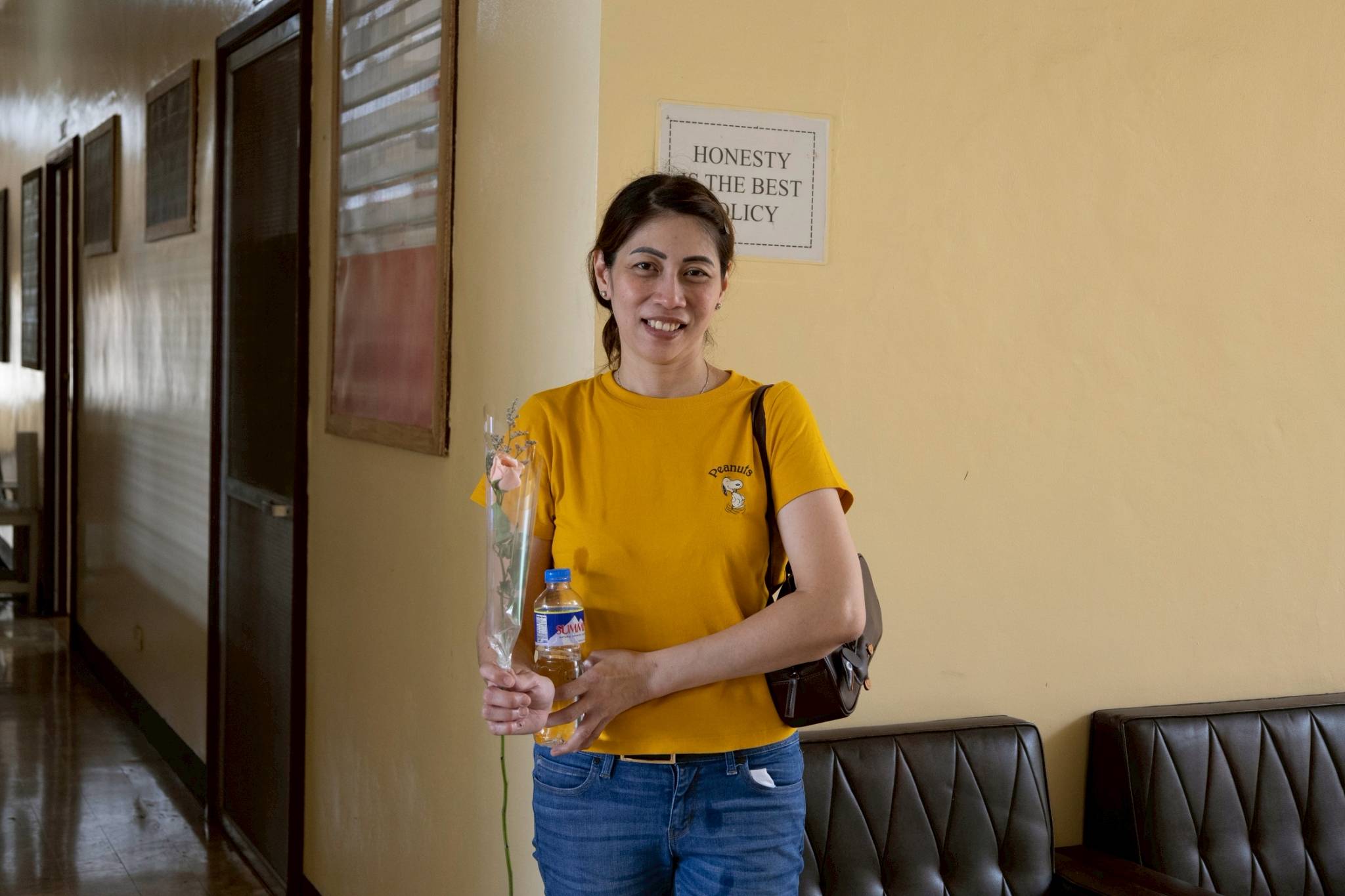 Volunteers gift  Jocelyn Tioco, who has been a constant anchor and rock for her aunt, with a token of appreciation. 