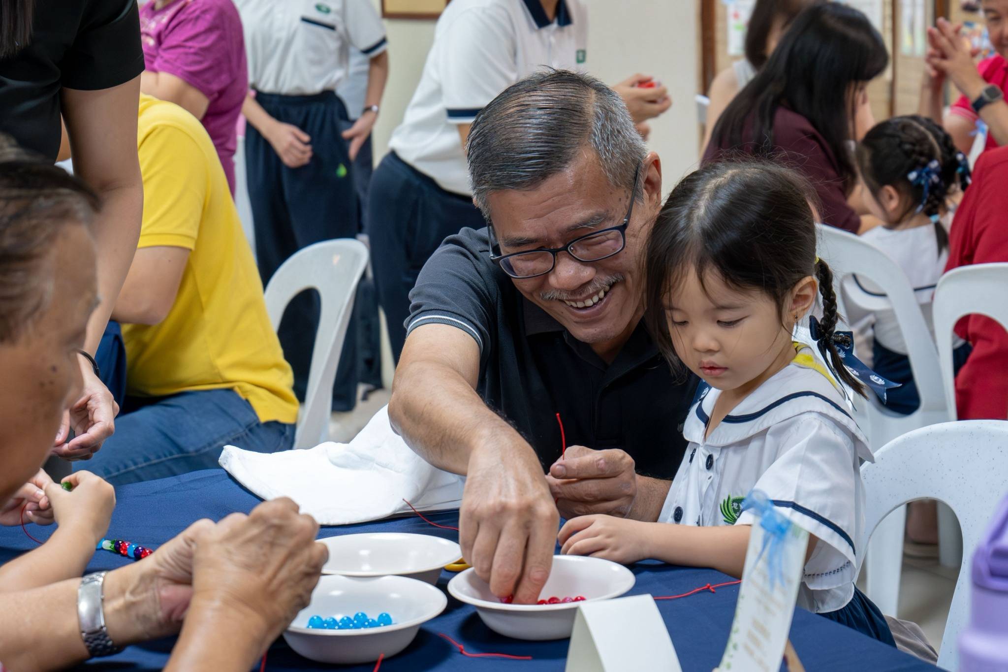 Grandparents enjoyed choosing their favorite colors for their bracelets.