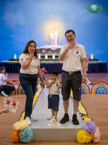 A family strikes a cute pose during the catwalk portion of the event.