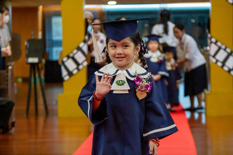 In this moving up ceremony, 15 students advance from pre-kindergarten to kindergarten.