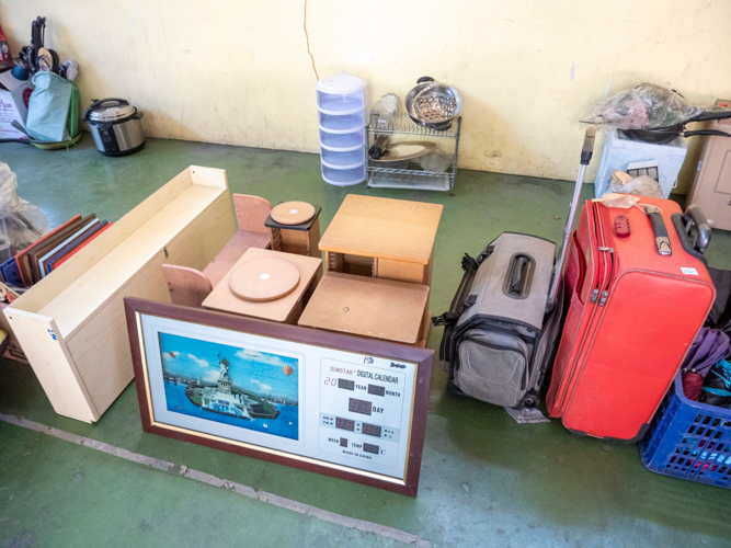 Different home items such as cabinets, shelves, and even suitcases were for sale during the bazaar. 【Photo by Dorothy Castro】