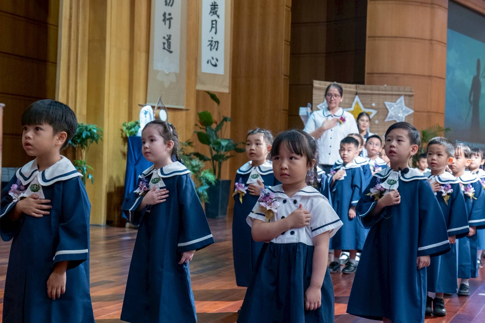 Tzu Chi pre-kindergarten and nursery students stand in attention for the Philippine National Anthem.