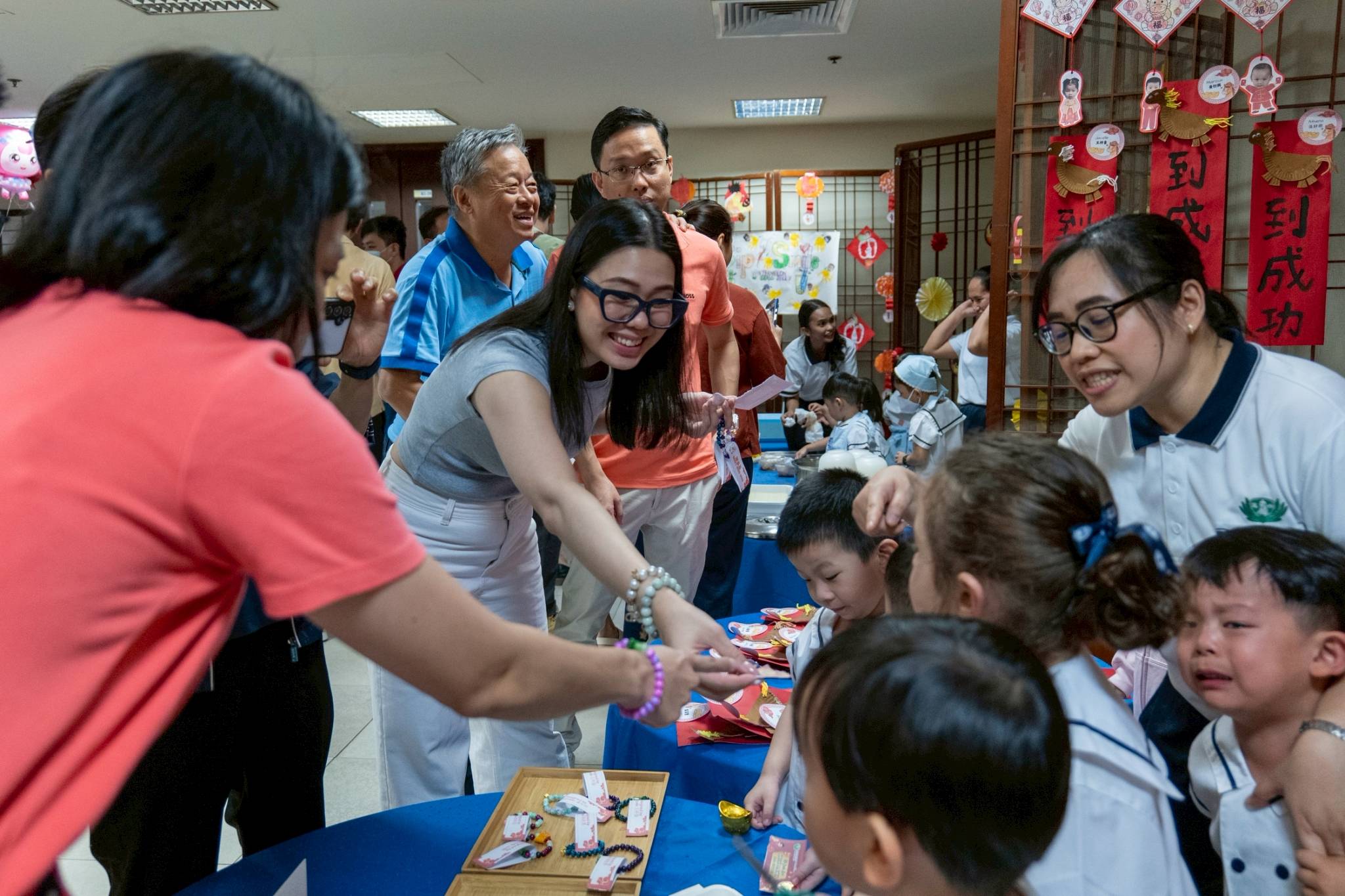 Parents eagerly visited the stalls, selecting from the treats and crafts on display.