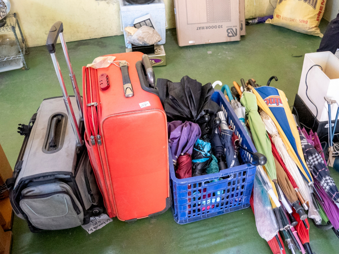 Various bags and umbrellas are neatly arranged for sale at the bazaar. 【Photo by Dorothy Castro】