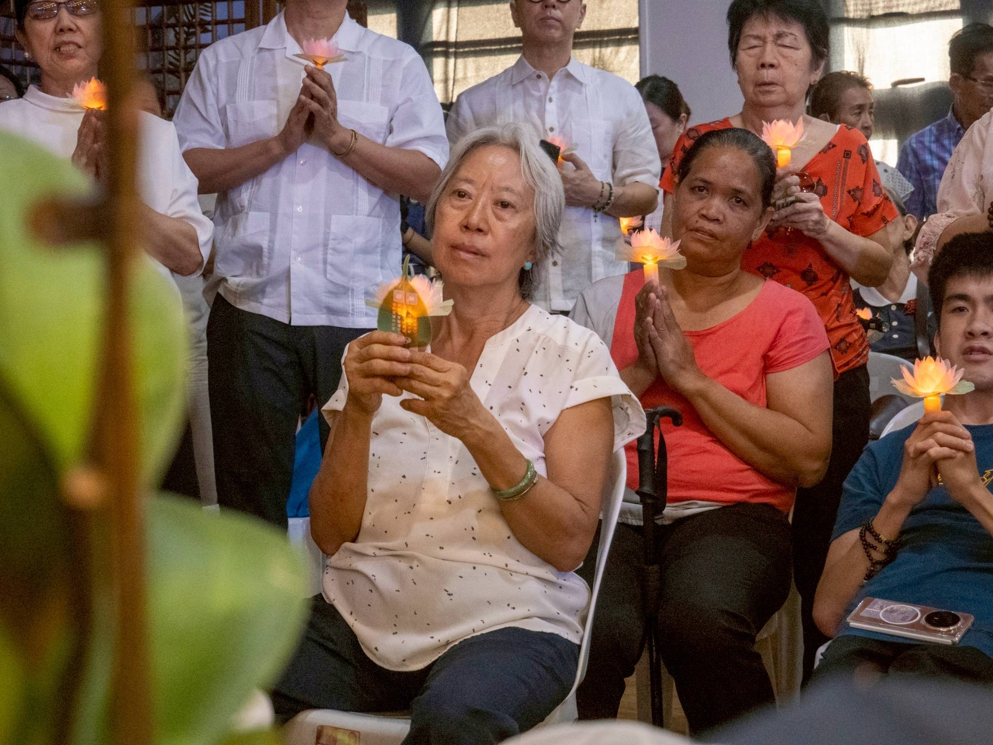 Guests and attendees pause for a shared moment of reflection and prayer.