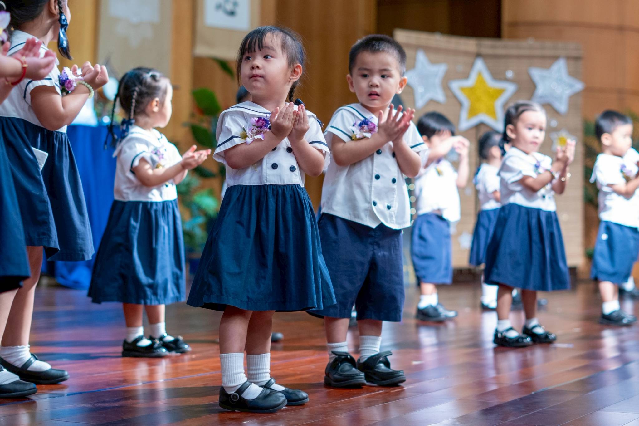 Nursery students charm audiences with their cute performance of a song that reflected their progress and growth. 
