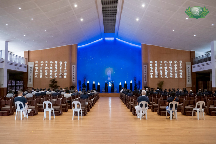 Volunteers spend the rest of the morning at the Jing Si Hall for a sutra chanting ceremony.