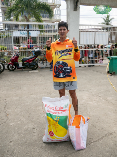 Jacinto Abata poses with a thumbs-up sign, acknowledging the support he received from Tzu Chi during two separate destructive typhoons.