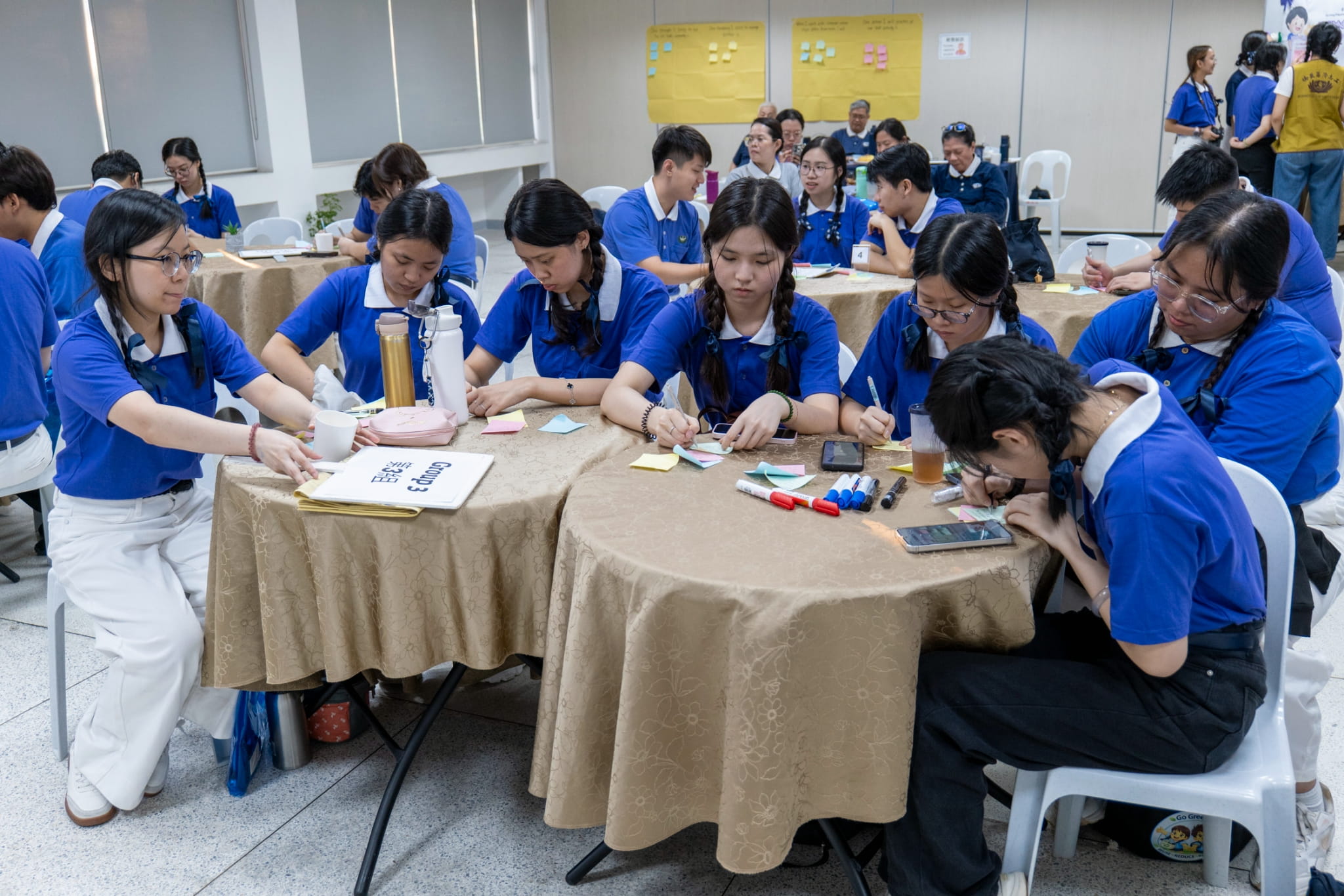 TCY inductees and members write what they are grateful for in Post-it notes.