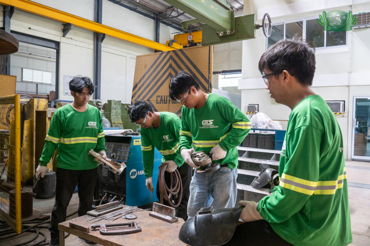 Gerald Seciban (first from left) with his fellow Tzu Chi Technical-Vocational scholars during their on-the-job training (OJT) in Greenpower Technology Services.