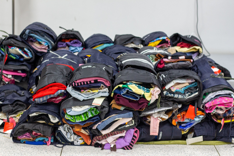 The pile of arranged and sorted clothes ready for distribution to hard-hit areas.