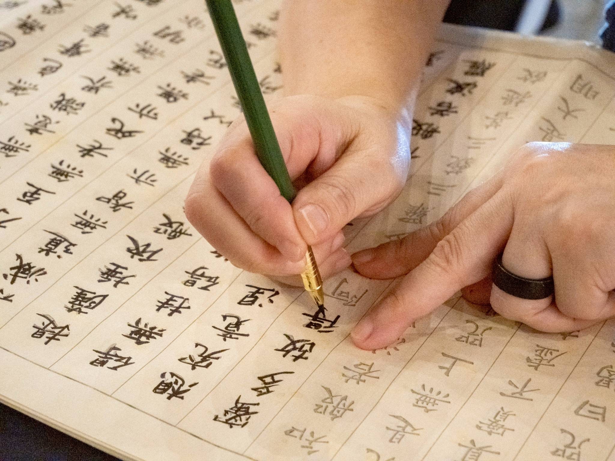 Through sutra calligraphy, participants reflect on cultivating tranquility and clarity in the new year.