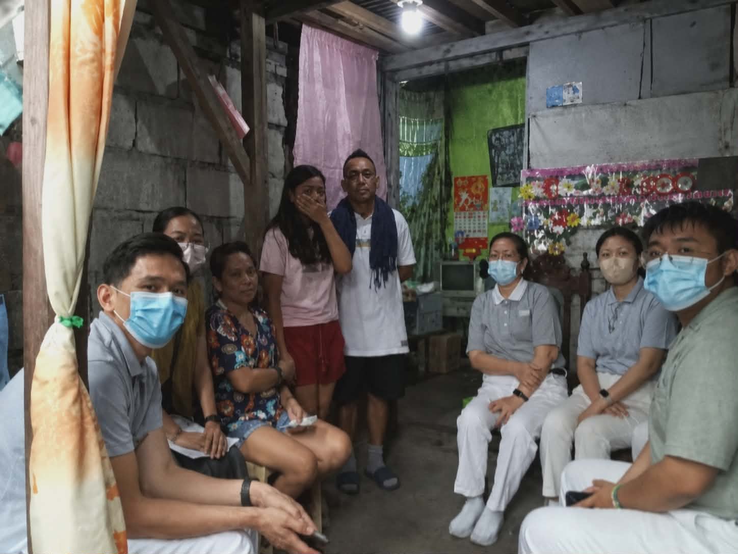 On March 17, 2026, Tzu Chi volunteers conduct a home visit in the home of Roselyn Rodriguez (third from left). 
