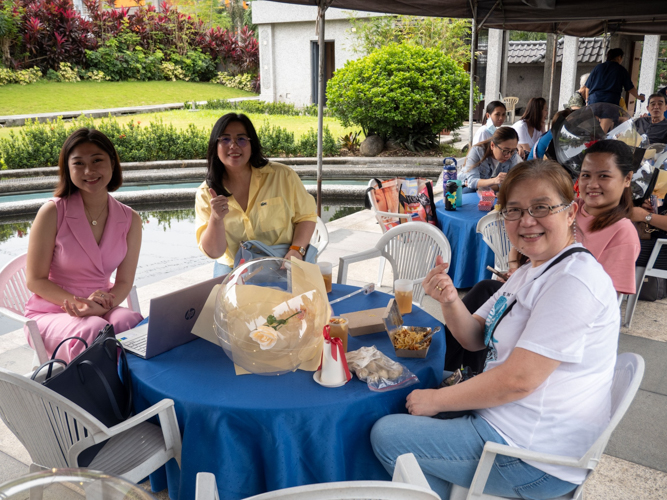 Parents share fun conversations with each other during the kiddie market.