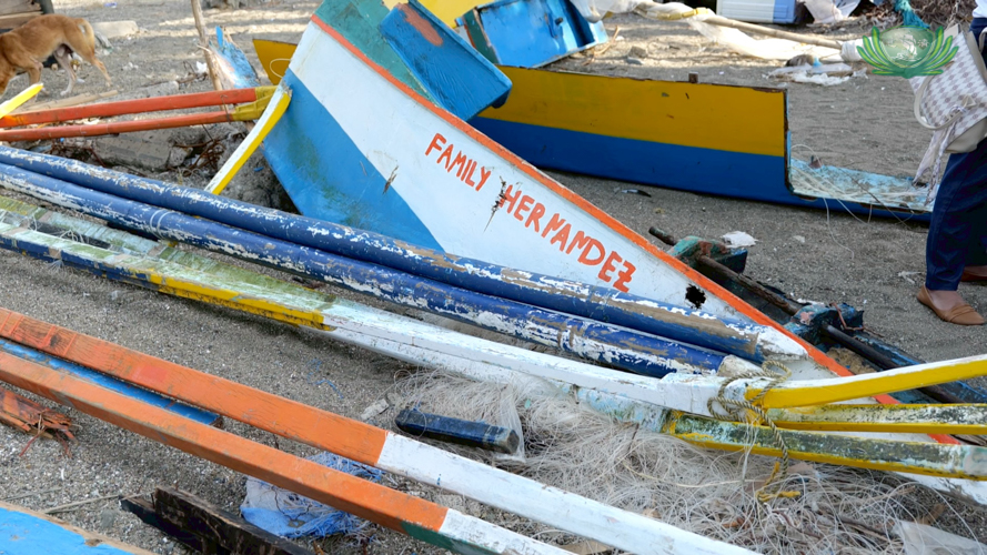 Elizabeth Hernandez’s family boat lies completely wrecked in Barangay Matawe, leaving them struggling for a livelihood. 