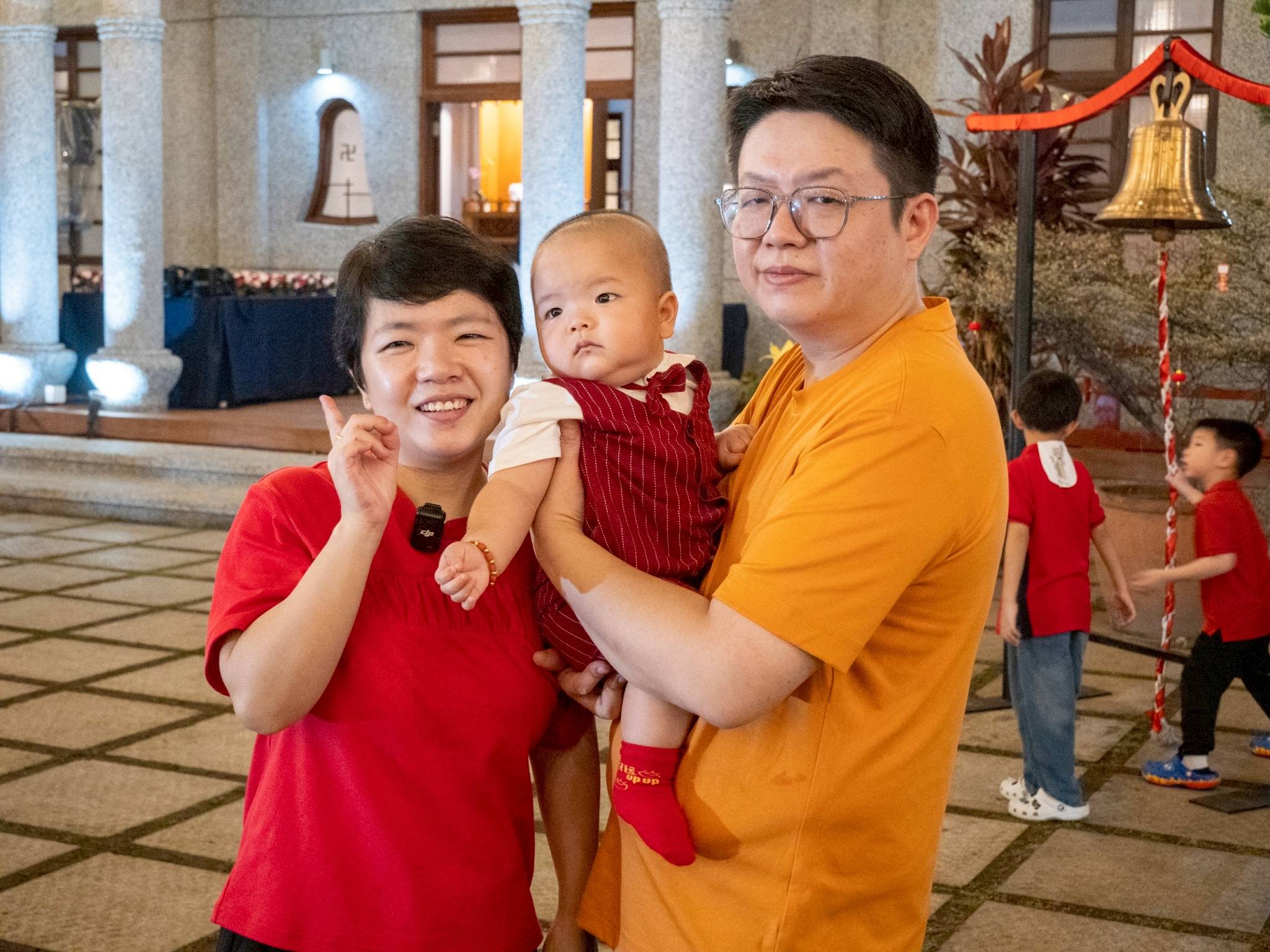 Eva Cu and her family pose for a photo while enjoying the gathering with others.