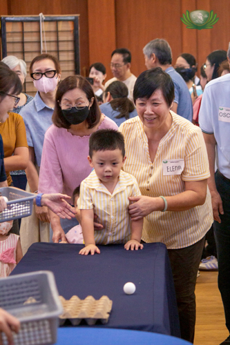 Win or lose at the egg carton pingpong ball game, grandparents treasure this joyful moment.