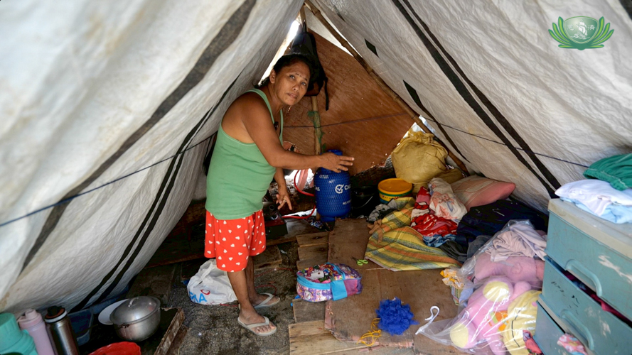 Elizabeth Hernandez shows the improvised tent that temporarily shelters her entire family. 