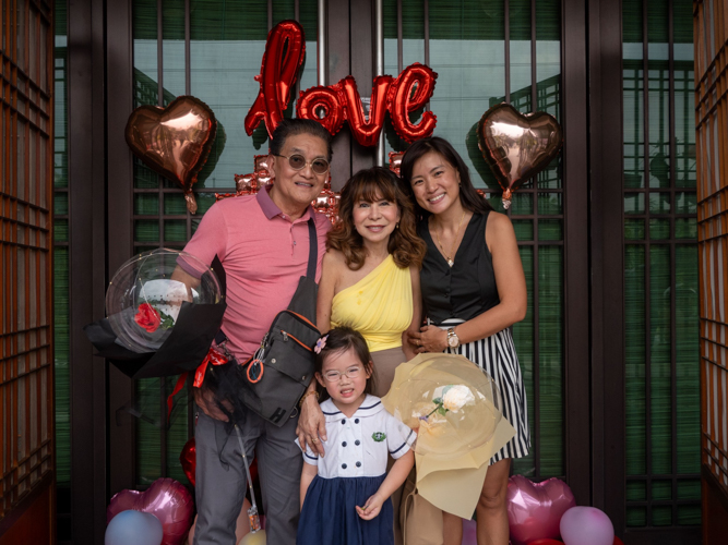 Families pose for photos at the kiddie market photo booth.
