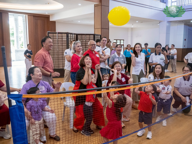 Laughter could be heard across the Jing Si Hall as children and their grandparents enjoyed a game of balloon volleyball.