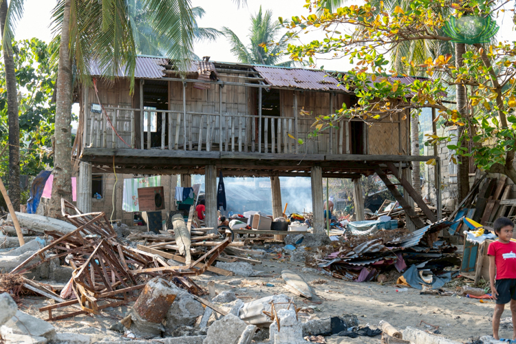 A resort in Barangay Matawe lies in ruins as powerful waves and storm surges swept through the area.