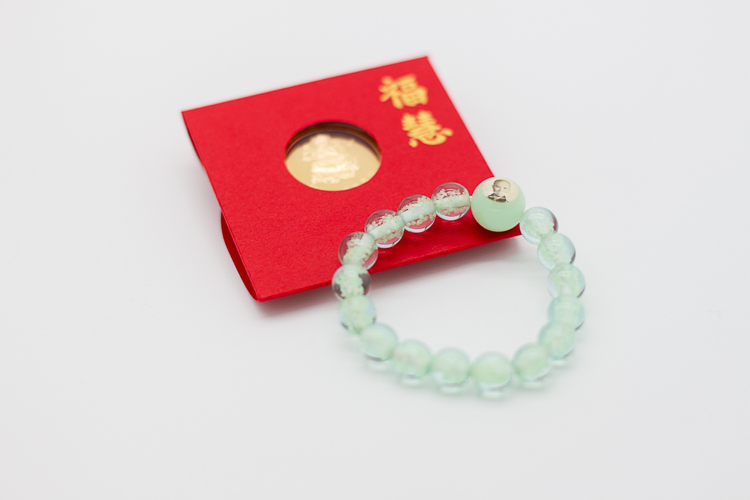 This second moving up ceremony was made more memorable with each student receiving a bracelet and red envelope from Dharma Master Cheng Yen.