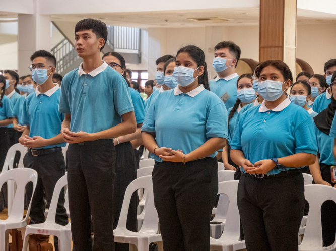 At the Jing Si Hall of Buddhist Tzu Chi Campus in Sta. Mesa, Manila, Axcel Rivera (third from right) joins fellow scholars in singing the Tzu Chi anthem.