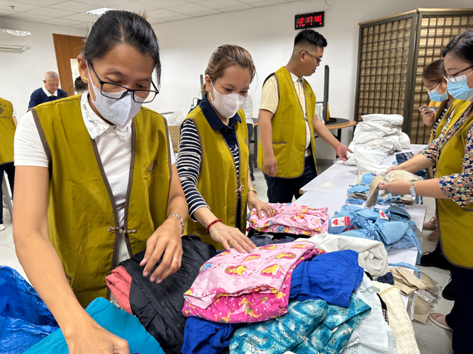 Clothing for children and undergarments are sorted by volunteers.
