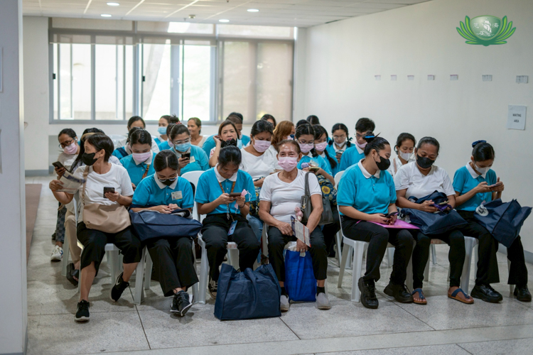 Tzu Chi scholars and their parents wait for their turn to be interviewed in the April 6 reapplication of college scholars at the Harmony Hall of Buddhist Tzu Chi Campus, Sta. Mesa, Manila. 