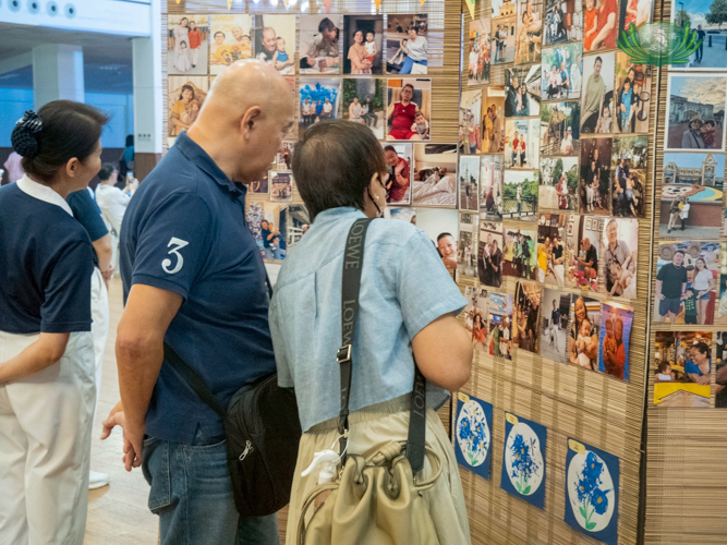 Grandparents appreciate their special photos at the preschool’s photo exhibit.
