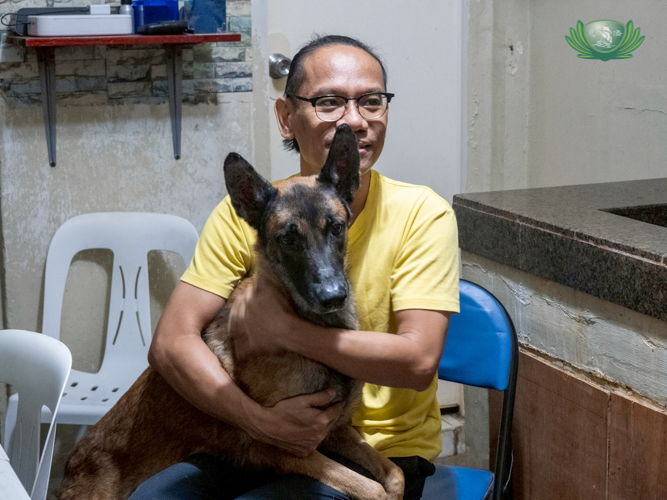When he works from home, Gerald Ritualo alternates sitting before a computer with playing with his dog, Jigs.