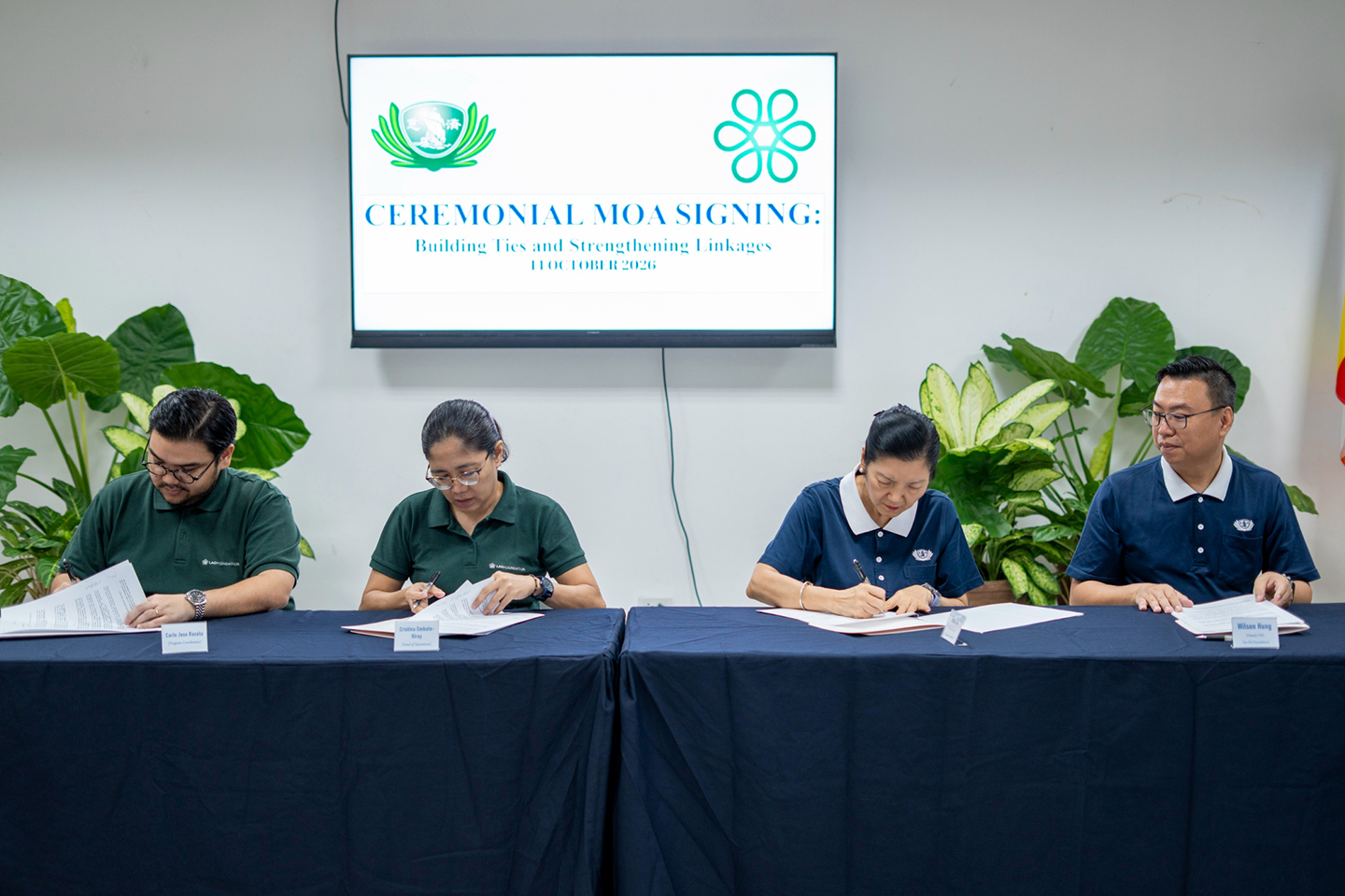(From left) Lao Foundation’s Program Coordinator Carlo Racela, Head of Operations Maria Christina Viray, Tzu Chi Head Volunteer for the Educational and Medical Assistance Programs  Rosa So, and Tzu Chi Deputy CEO Wilson Hung sign the Memorandum of Agreement. 