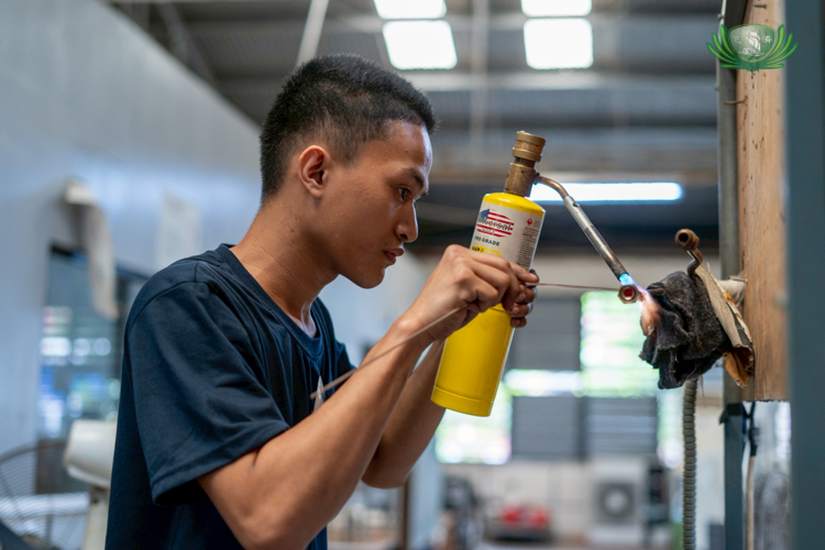 Abdul Karim Madale demonstrates skills gained in class as he works on a task. 